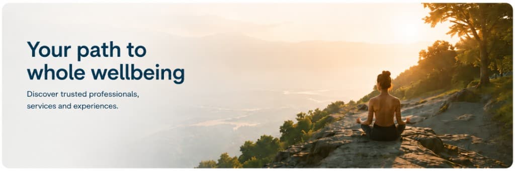 Your path to whole wellbeing. Discover trusted professionals, services and experiences. Person meditating at sunrise above a misty valley.